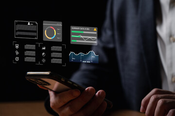 young entrepreneur using big data analysis and cloud technology to collect customer data and display on application dashboard from digital tablet to understand sale forecast and marketing plan.