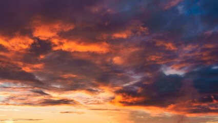 Colorful dramatic sunset with cloudy sky