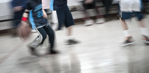 Player Dribbling Basketball Down Court During Game Competition