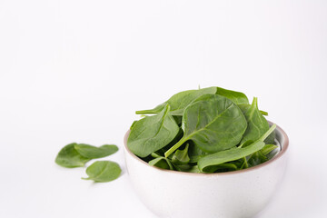 a bowl of spinach, close-up, copy space