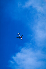 Airplane flying in the blue sky
