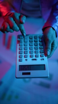 Upper view of modern female with calculator.