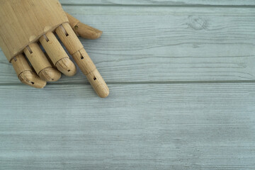 Wooden Hand on the table with copy space