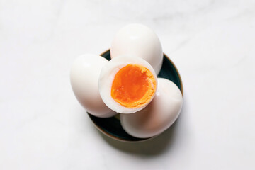 Boiled eggs on white table background.