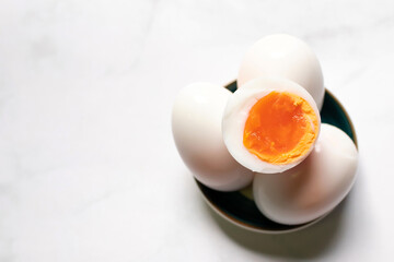Boiled eggs on white table background.
