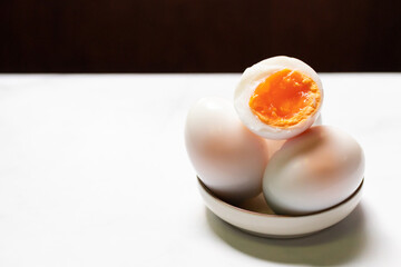 Boiled eggs on white table background.