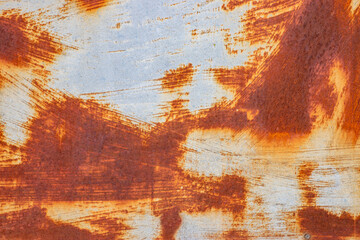 Rusted white painted metal wall. Rusty metal background with streaks of rust. Rust stains.