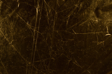 Gold foil leaf shiny metallic wrapping paper texture background for wall paper decoration element