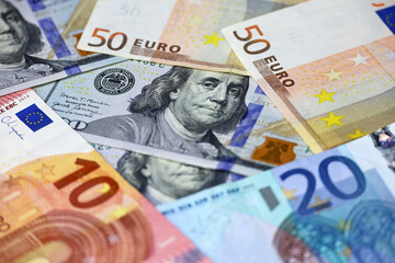 US dollars and euro banknotes. Concept of exchange rate, investment and trade between the United States and European Union