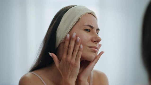 Worried lady facial wrinkles problem at mirror. Sad woman checking mimic muscles Generative AI