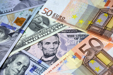 US dollars and euro banknotes. Concept of exchange rate, investment and trade between the United States and European Union