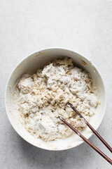 Loosely folded bread dough, bread dough being mixed with chopsticks, low hydration dough, process of making bread