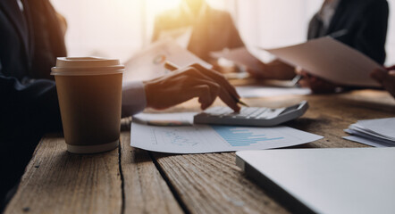Brainstorming Collaboration and successful partnership analysis by Young business Asian people working in an office workspace