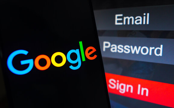 May 1, 2023, Brazil. In this photo illustration, the Google logo is displayed on a smartphone screen, next to a login screen, with email, password and sign in.