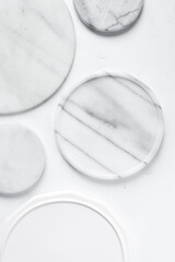 Fototapeta na wymiar Round white marble trays, marble cake tray or dessert pedestal, white marble tray with gray veining