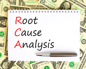 RCA root cause analysis symbol. Concept words RCA root cause analysis on white note. Dollar bills. Beautiful background from dollar bills. Business and RCA root cause analysis concept. Copy space.