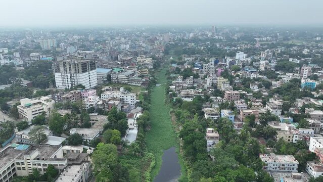 River in the city aerial smooth video footage, karatoa river, bogura, bangladesh ,aerial view of the city