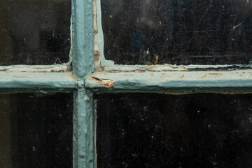 Closeup of chipping lead painted window frame