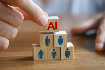 Close up shot of Man's hand putting the AI written wooden cube on top of others. Artificial Intelligence versus human concept.