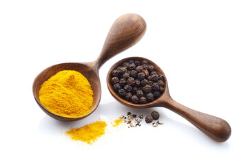 Turmeric powder with black peppers on white background