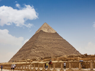 Fototapeta na wymiar Egyptian pyramids in sand desert and clear sky
