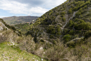 Longest Tibetan bridge in the world located in Castelsaraceno in Italy. The steel bridge spans 580m on a walkway with separate platforms overlooking a breathtaking panorama.