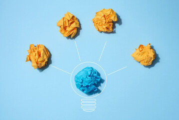 The concept of inspiration with new ideas, the search for creative solutions, crumpled sheets of...