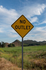 A no outlet road side traffic sign