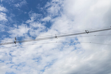 Obraz premium Longest Tibetan bridge in the world located in Castelsaraceno in Italy. The steel bridge spans 580m on a walkway with separate platforms overlooking a breathtaking panorama.