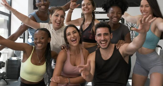 Group of diverse sportspeople having fun in gym