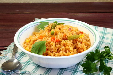 indo chinese or mexican cuisine food veg fried rice known in india as basmati rice,veg pulav,veg biryani,khichdi,top view in bowl,