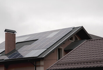 Fototapeta na wymiar Solar energy from solar panels on rooftops