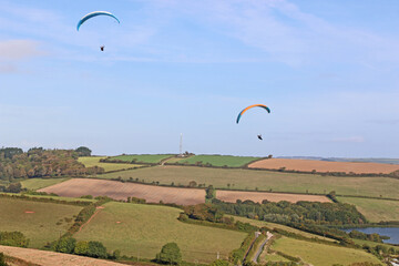 Paragliders flying from a hill	