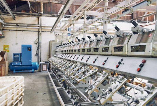industrial stainless steel metal cotton weaving machines , machine weaving cotton for the fashion and textiles industry. Yarn weave traditional textile manufacturing mass production.
