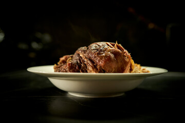 meat baked in the oven lies on a plate