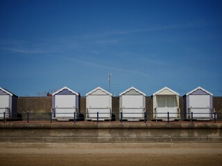 Fototapeta na wymiar Row of Beach Modern Beach Huts