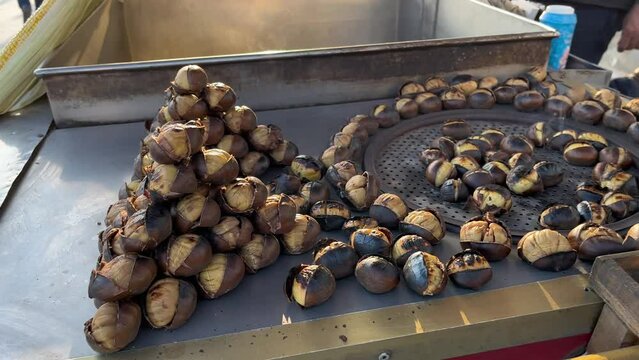 roasted chestnuts want to be eaten - stock video