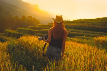 Foto op Plexiglas Soft focus on photographer woman taking photos with slr camera professional photography at rice terrace in Sapa, Vietnam © nonglak