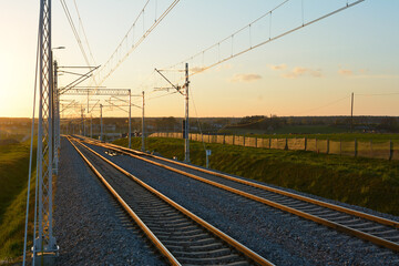 Fototapeta na wymiar Railroad track during spring evening in countryside