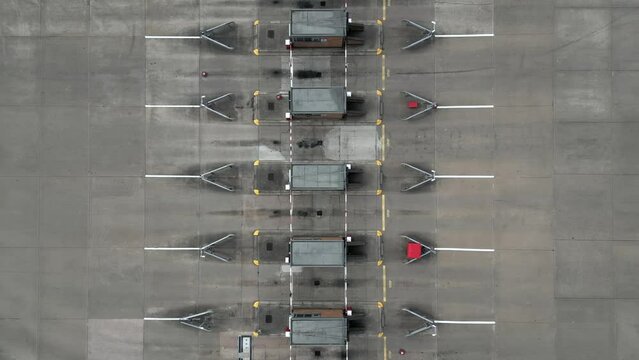 Rising aerial view of a security gate for a truck freight and logistics area