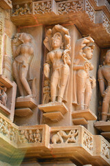 Fototapeta na wymiar Khajuraho Group of Monuments are a group of Hindu and Jain temples famous for their nagara-style architectural symbolism and a few erotic sculptures