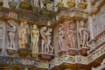 Fototapeta na wymiar Khajuraho Group of Monuments are a group of Hindu and Jain temples famous for their nagara-style architectural symbolism and a few erotic sculptures