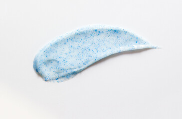 Sample texture of toothpaste with calcium hydroxyapatite on a white background. Selective focus, copy space