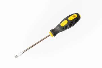 A screwdriver. A working tool. Flat screwdriver on a white background. Repair and construction