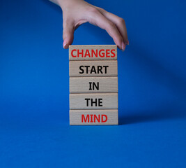 Changes start in the Mind symbol. Wooden blocks with words Changes start in the Mind. Beautiful...