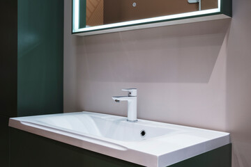 Fototapeta na wymiar Washbasin with faucet in minimalist modern bathroom, bathroom interior