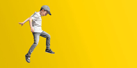 Fototapeta na wymiar boy jumps on a color background