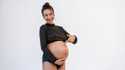 Pregnant belly. Woman standing and touching her naked big belly. a cute pregnant belly. belly of a...