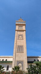 Fototapeta premium Tower of mosques in Morocco with an Islamic design, city of Tangier. Islamic architecture, Africa.