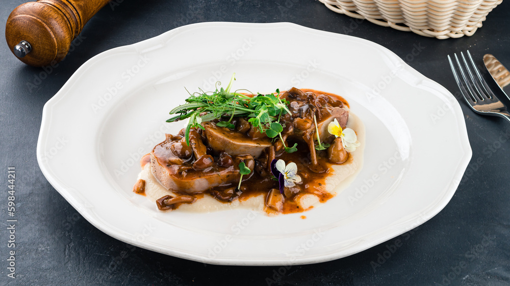 Canvas Prints fried beef tongue medallions with sauce and microgreens.